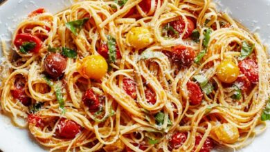 Creamy pasta bake with cherry tomatoes and basil