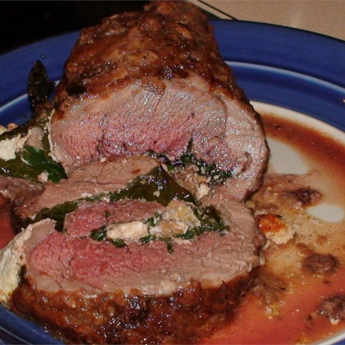 Broiled and slow roasted butterflied leg of lamb with cumin and garlic