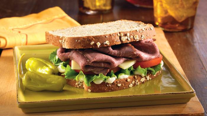 Dripping roast beef sandwiches with melted provolone