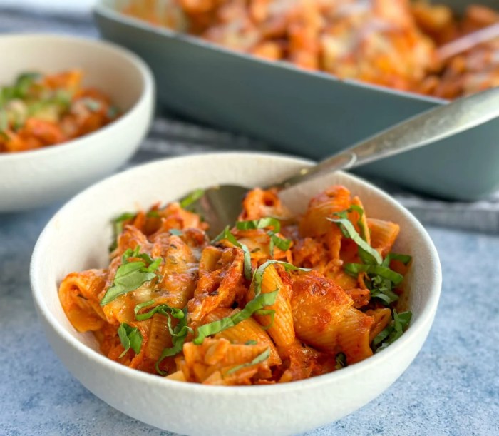 Creamy pasta bake with cherry tomatoes and basil