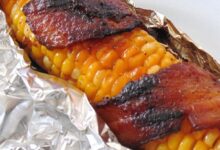 Grilled bacon wrapped corn on the cob