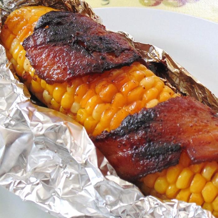 Grilled bacon wrapped corn on the cob