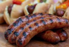 Grilled sausages with caramelized onions and apples