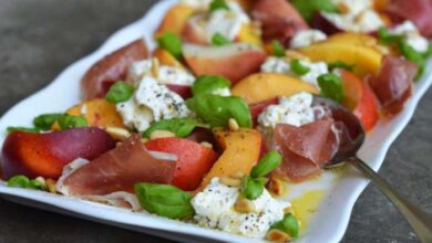 Grilled prosciutto wrapped peaches with burrata and basil