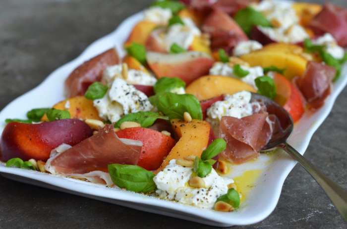 Grilled prosciutto wrapped peaches with burrata and basil