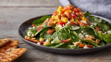 Colorful kale and spinach salad and homemade dressing