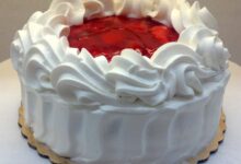 Carry cake with strawberries and whipped cream