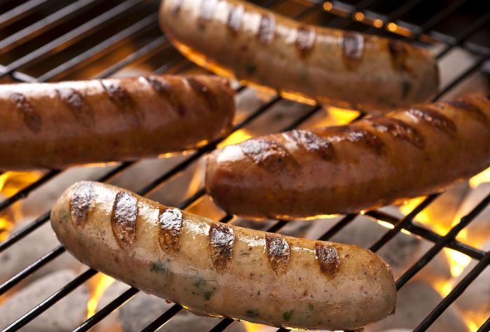 Grilled sausages with caramelized onions and apples