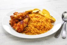 Nigerian jollof rice with chicken and fried plantains