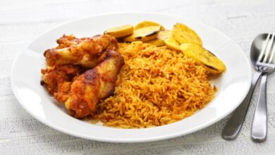 Nigerian jollof rice with chicken and fried plantains