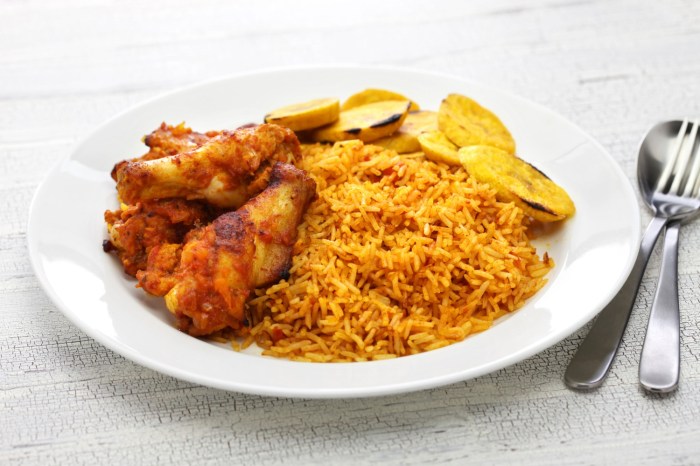 Nigerian jollof rice with chicken and fried plantains