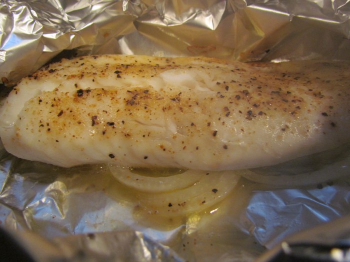 Grilled herbed tilapia in foil packets