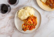 Pork chops with fresh tomato onion garlic and feta