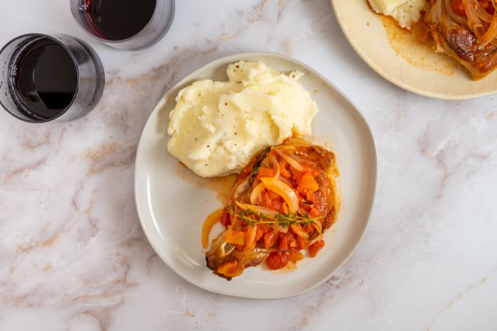 Pork chops with fresh tomato onion garlic and feta